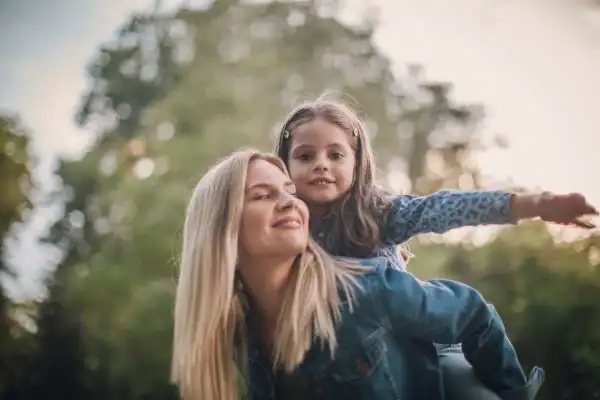 happy mum and daughter following mediation to resolve parental alienation Oldham